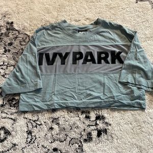 Womens XS Ivy Park crop top. Only worn a couple times! Blue-green color.